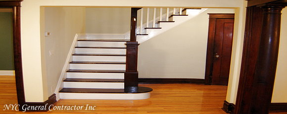 Opening squared uut for a modern look - Notice how the stairs are refinished with new stain and polyurethane - Are you noticing how the beautiful new hard wood flooring shines?... General Contractor