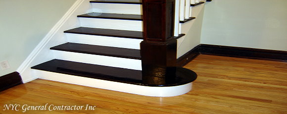 Taking a closer look at the stair landing at the bottom of the stairs - See how the left bottom side of the stairs transistion into the baseboard molding - Pretty neat don't you think?... General Contractor
