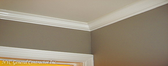The second floor main bathroom looking up at the installed crown molding throughout the bathroom - Look at those miters!... General Contractor