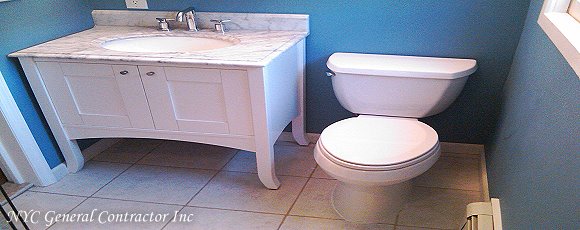 Here you have the after effect from the bathroom remodeling - Complete with four legged vanity with a marble under mount sink - New Kohler toilet bowl, ceramic tiled floor, new moisture resistant drywall and freshly painted... General Contractor